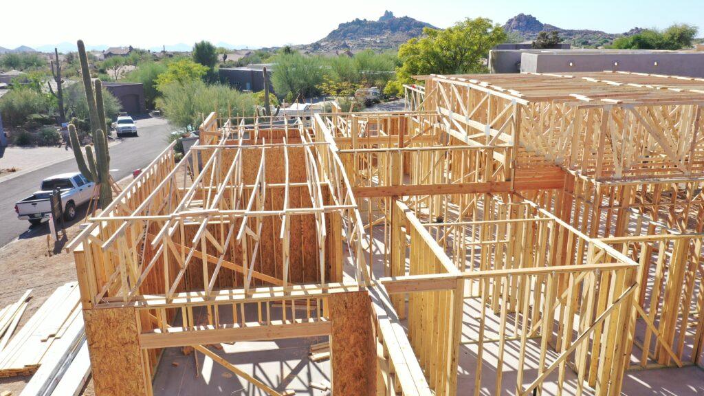 Luxury custom home under construction in Scottsdale Arizona during the framing stage