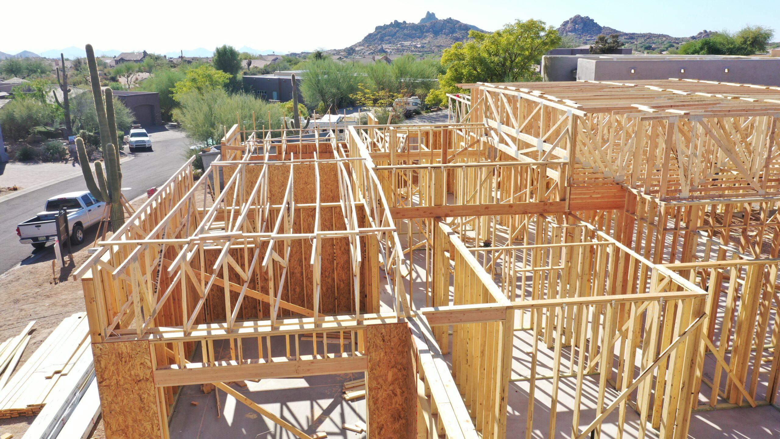 Luxury custom home under construction in Scottsdale Arizona during the framing stage